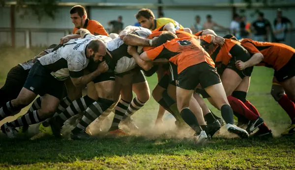 Rugby players packing down in a scrum